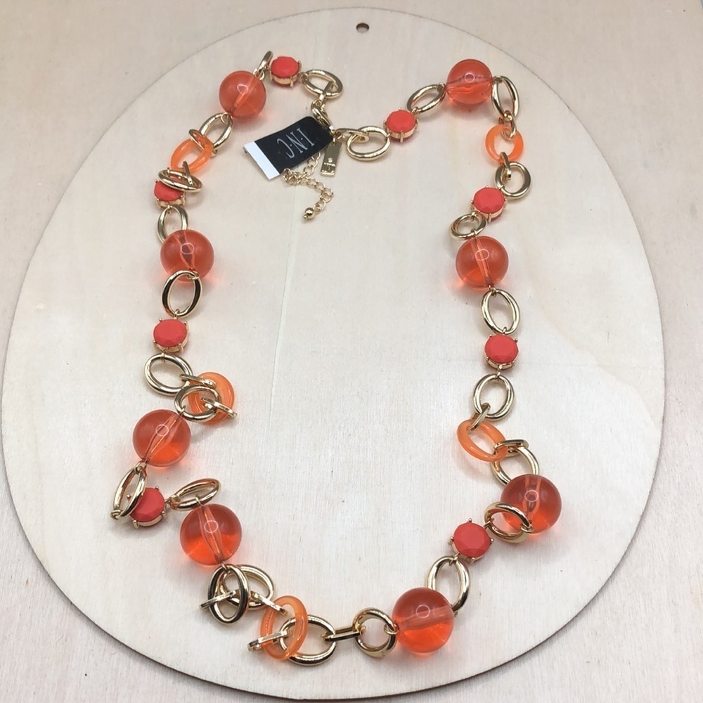 INC gold chain necklace with peach popsicle resin ball beads, long.
